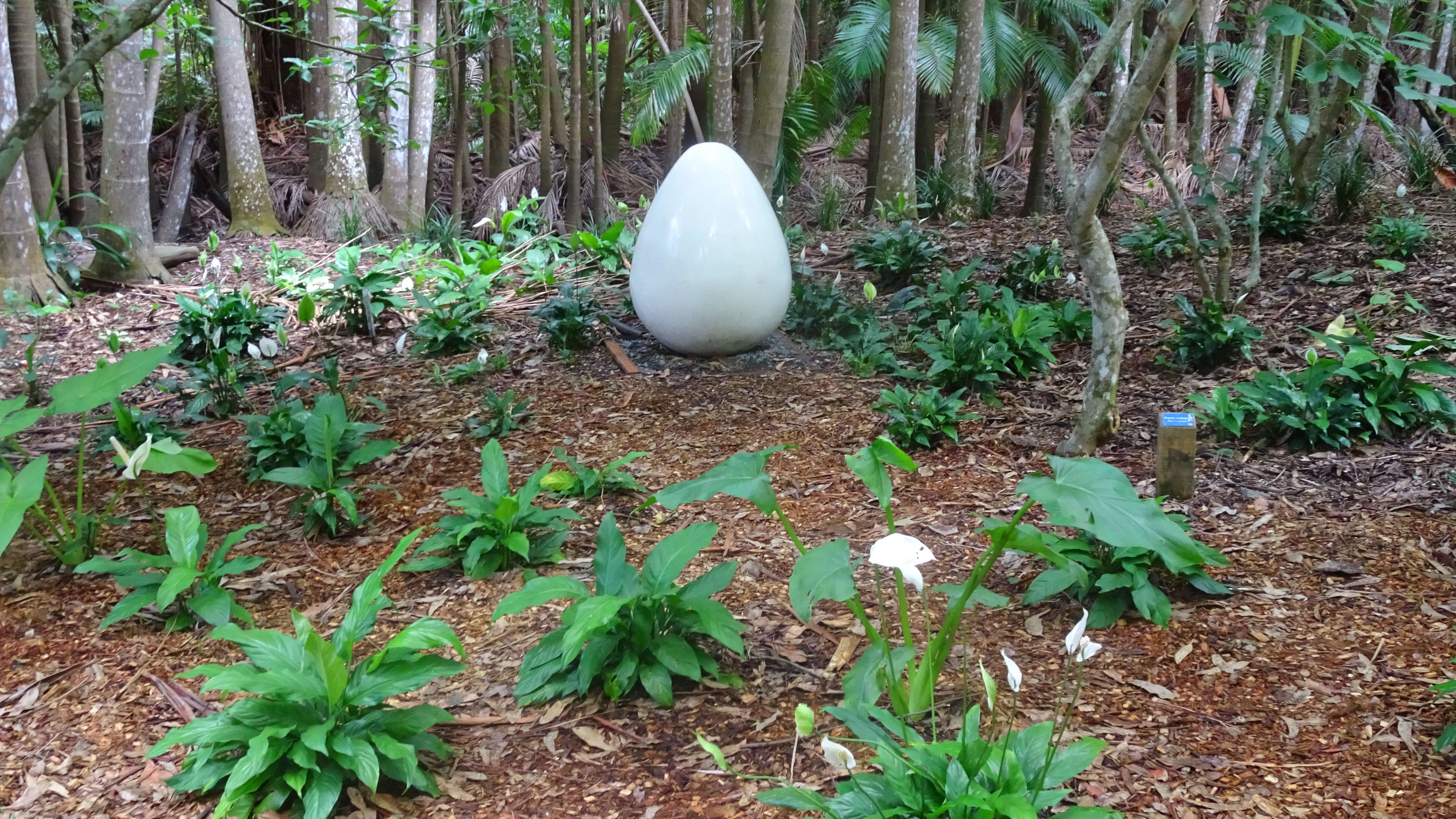 Giant white porcelain-looking egg in Japanese garden