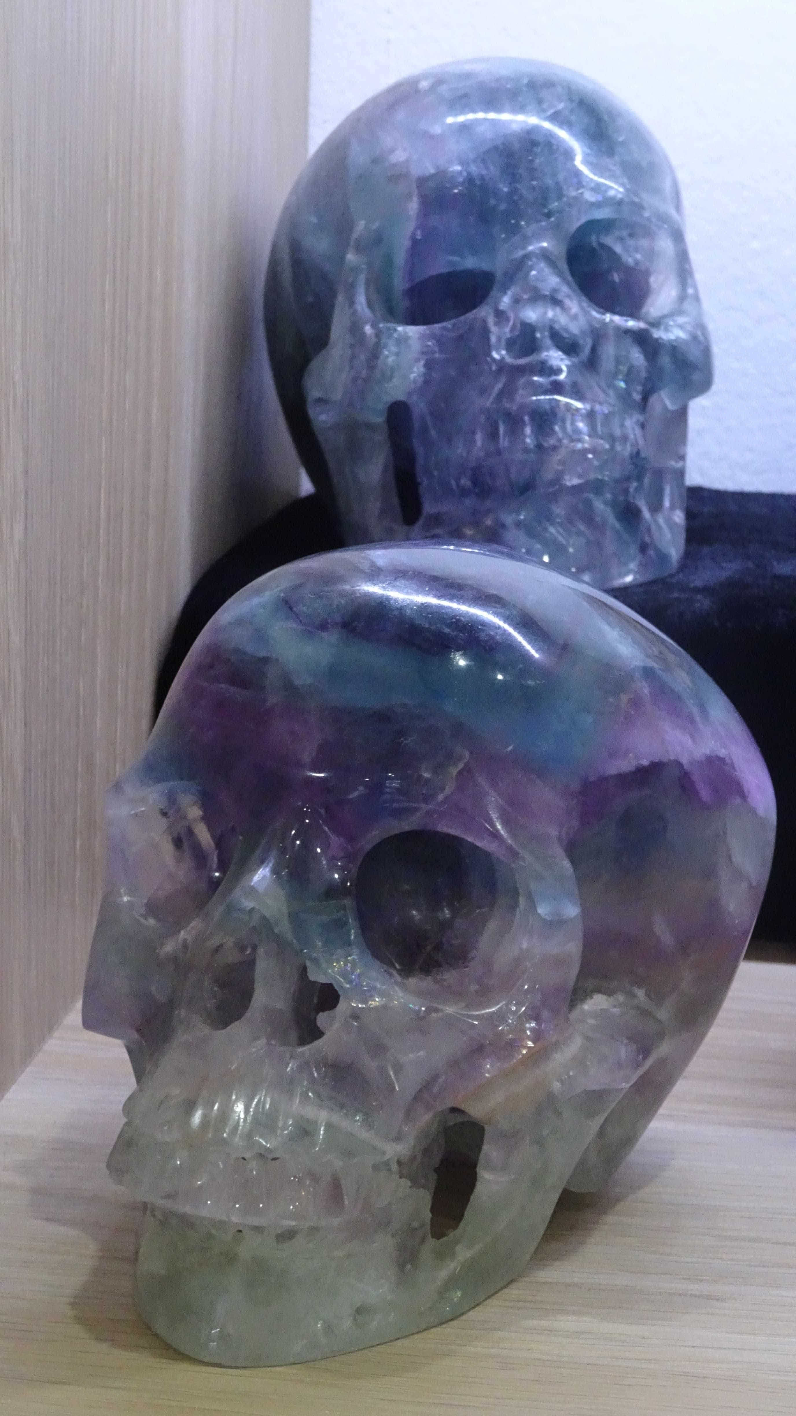 Two rainbow fluorite crystal skulls