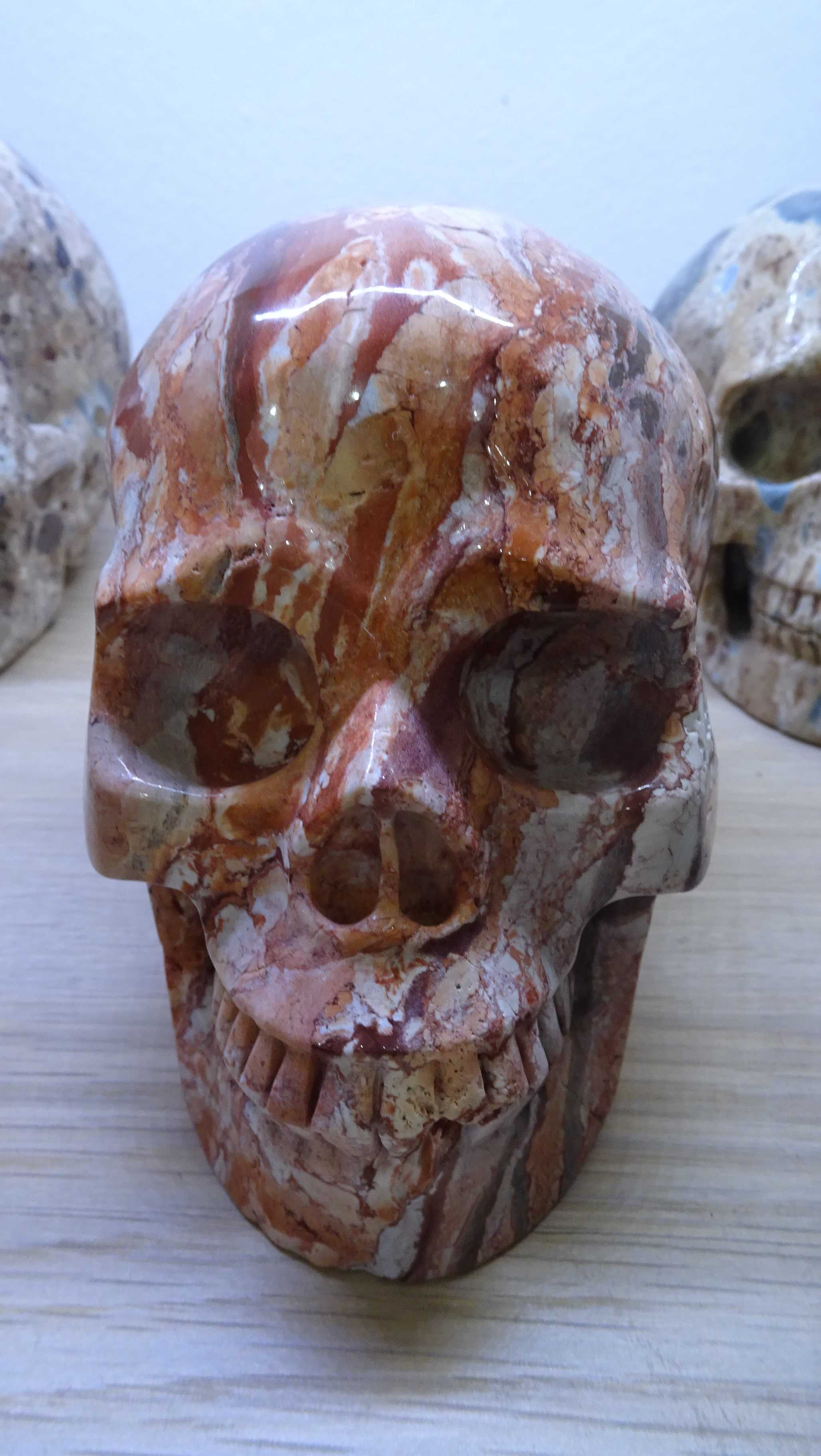 Carved red crazy lace agate skull