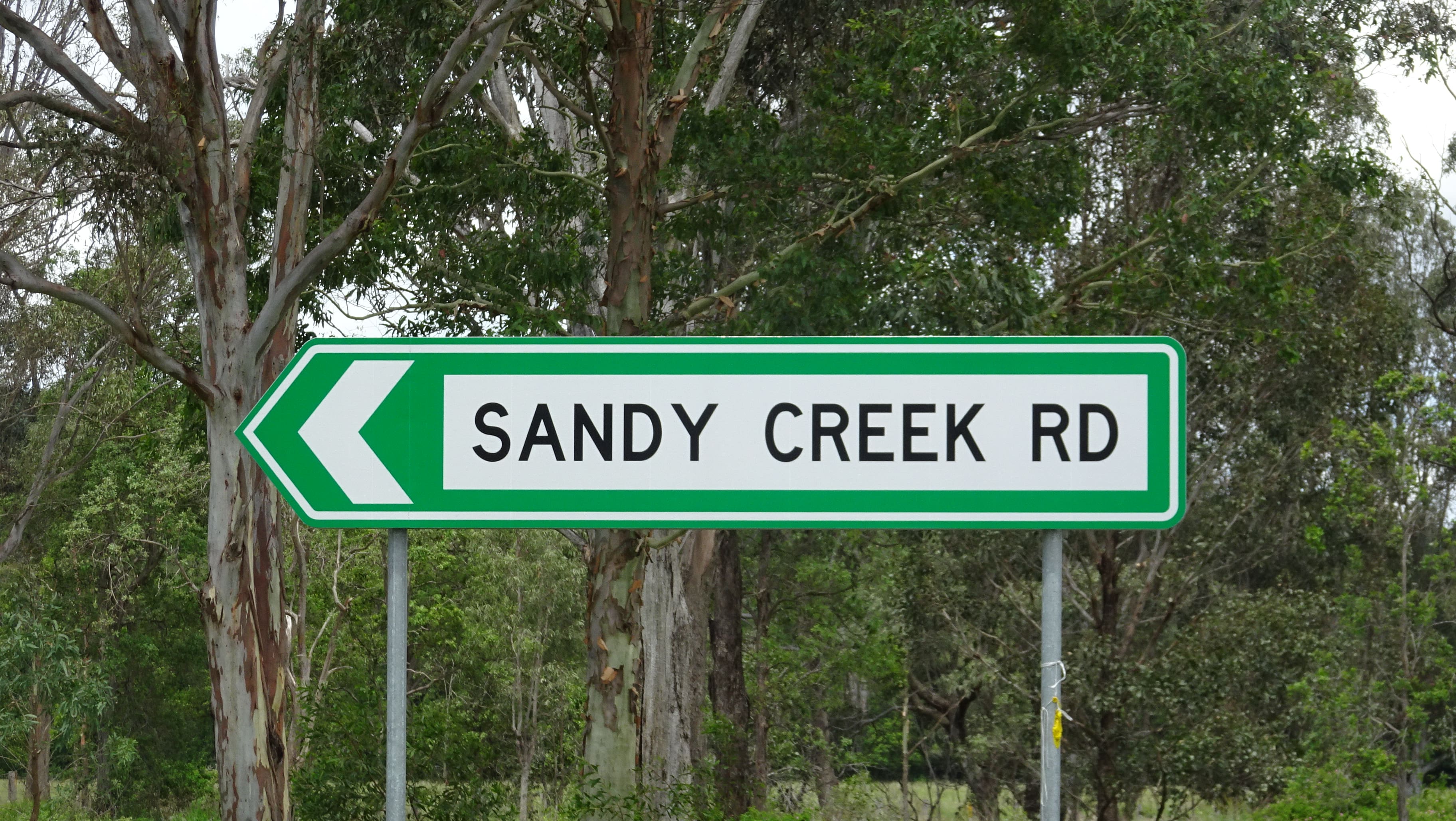 Road sign to Sandy Creek