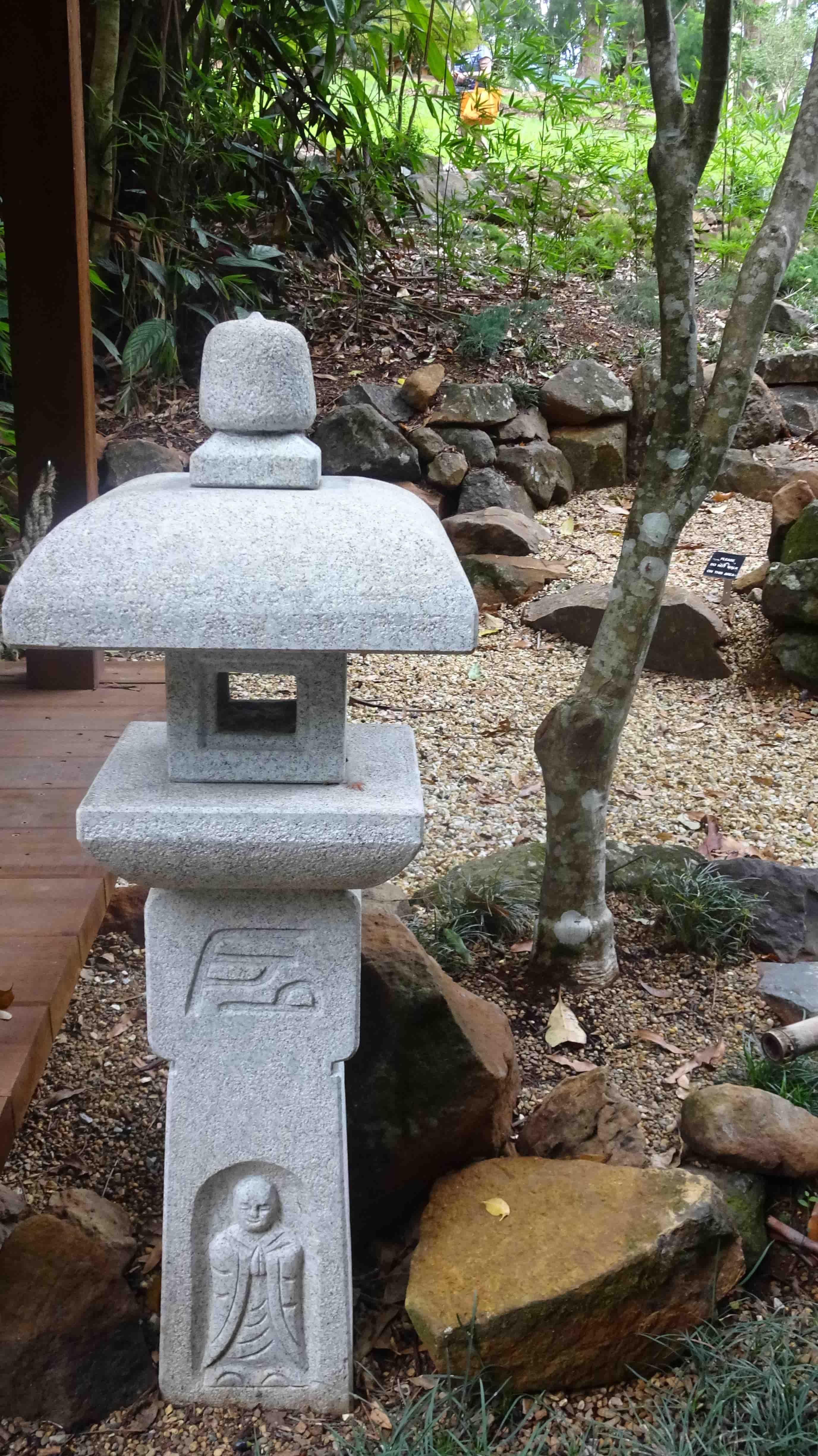 Carved Japanese statue in garden