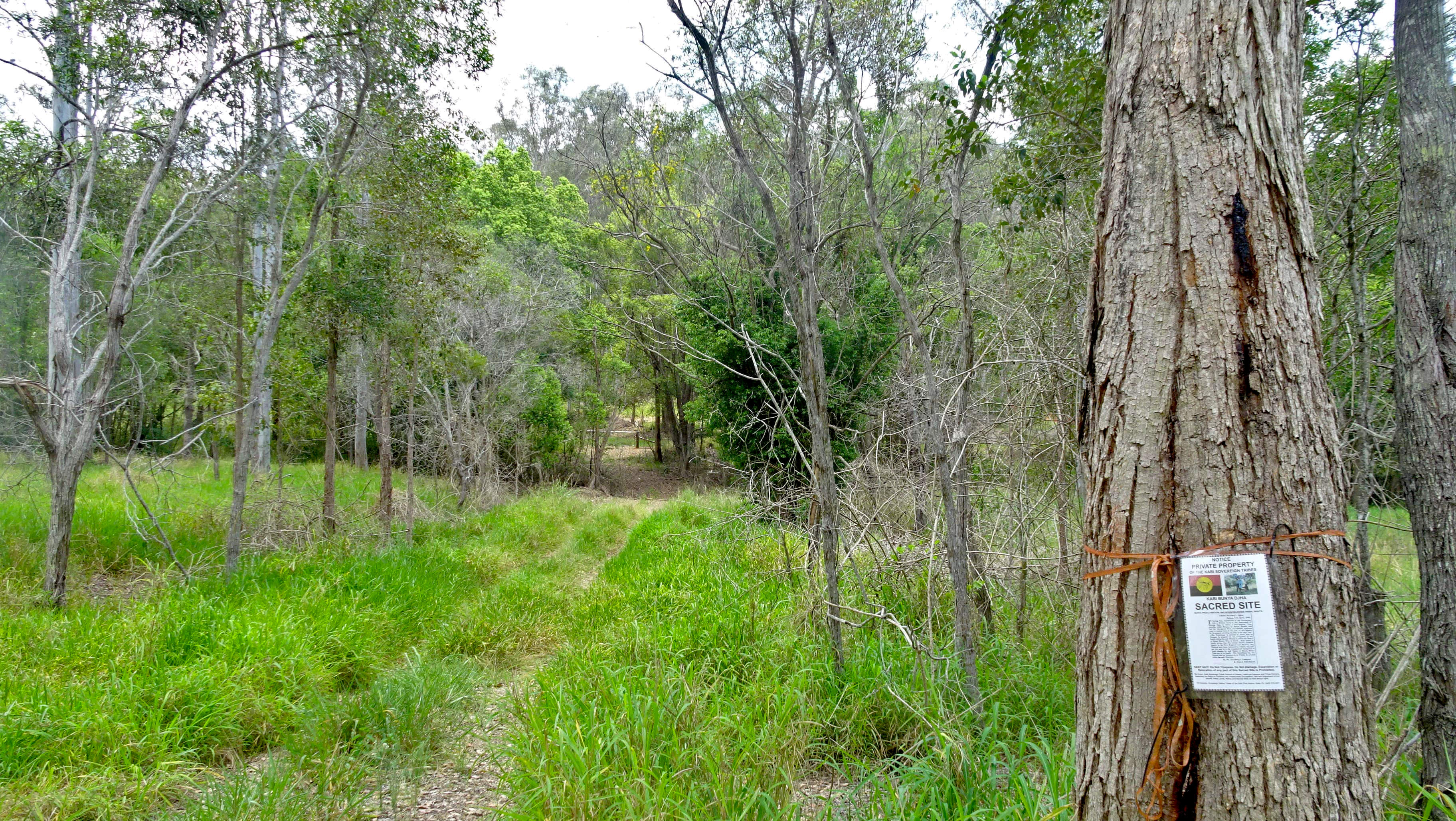 Dirt track leading to gated private property