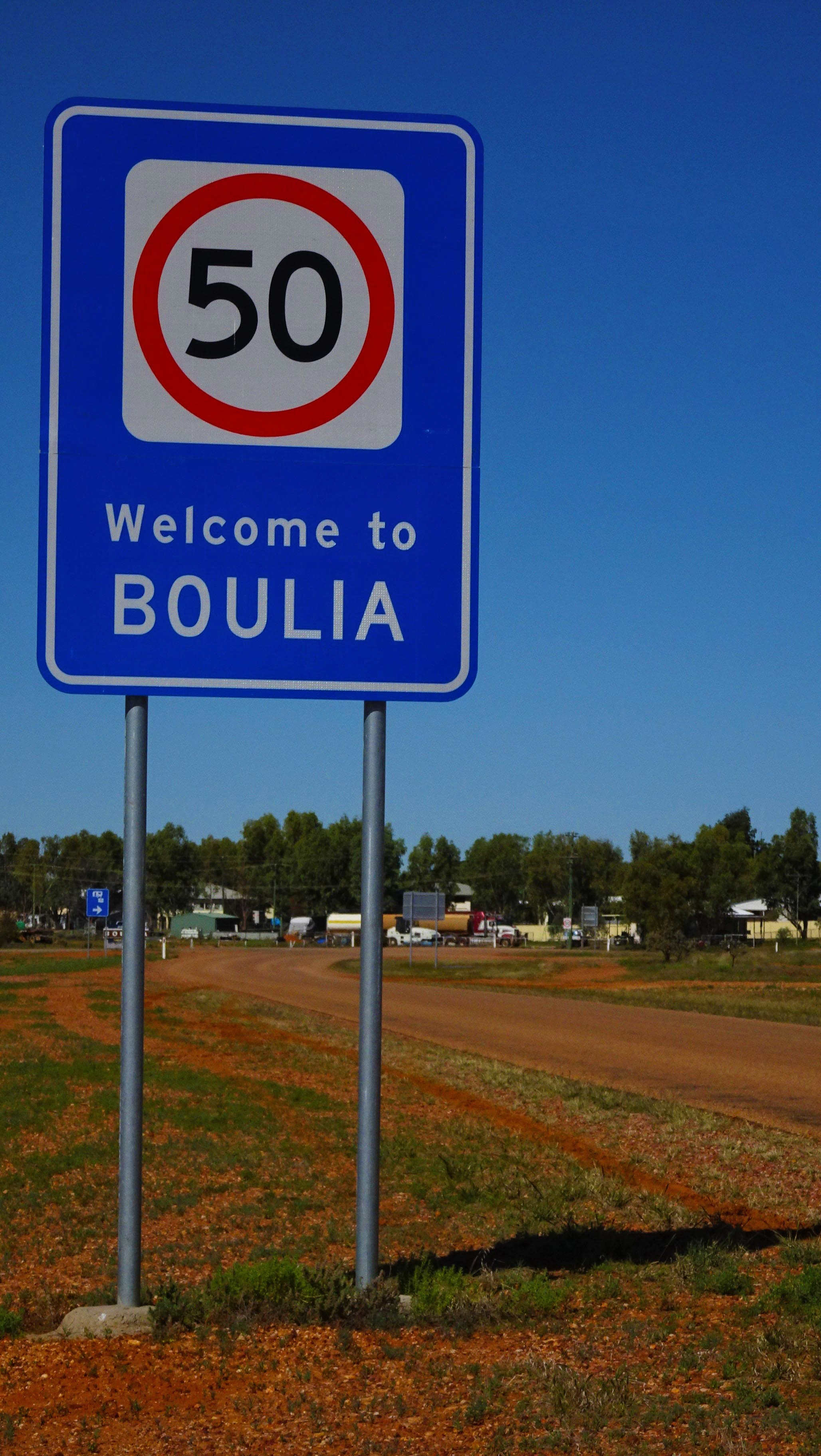 Welcome to Boulia road sign with speed limit
