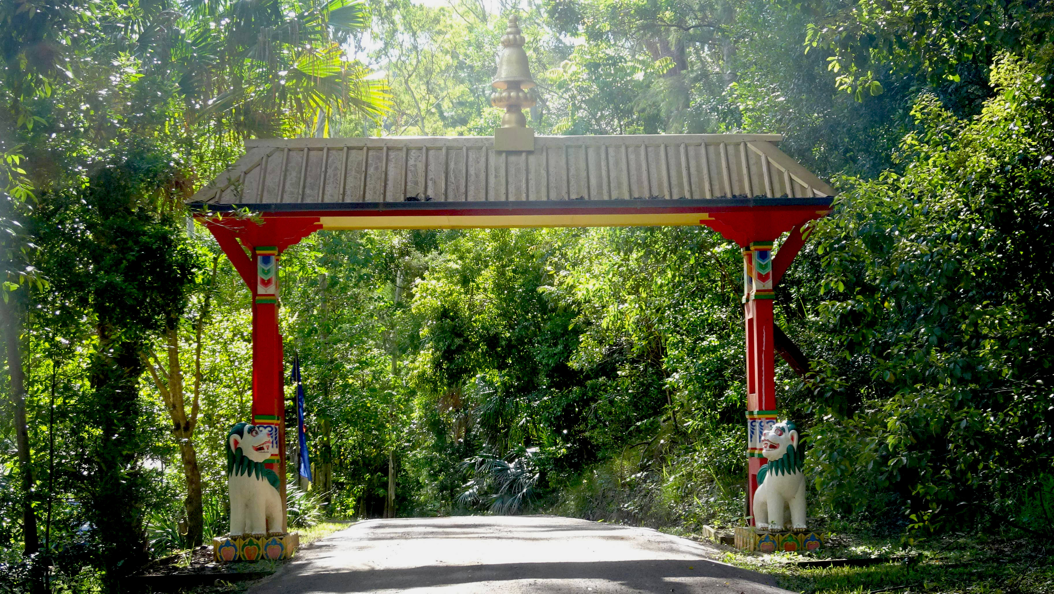 Ornate painted entrance gate in bush setting