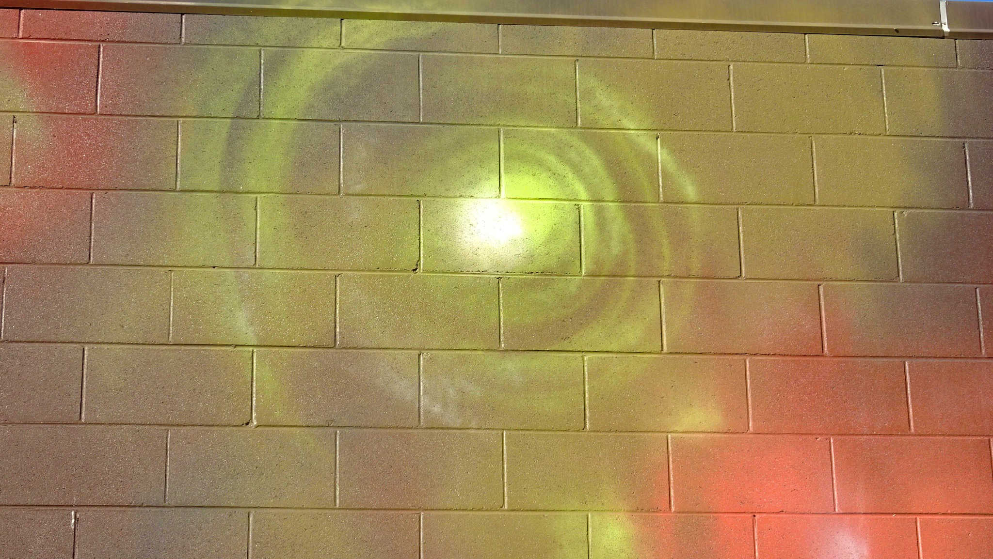 Mural on brick wall depicting green spectral ghostly Min Minlight
