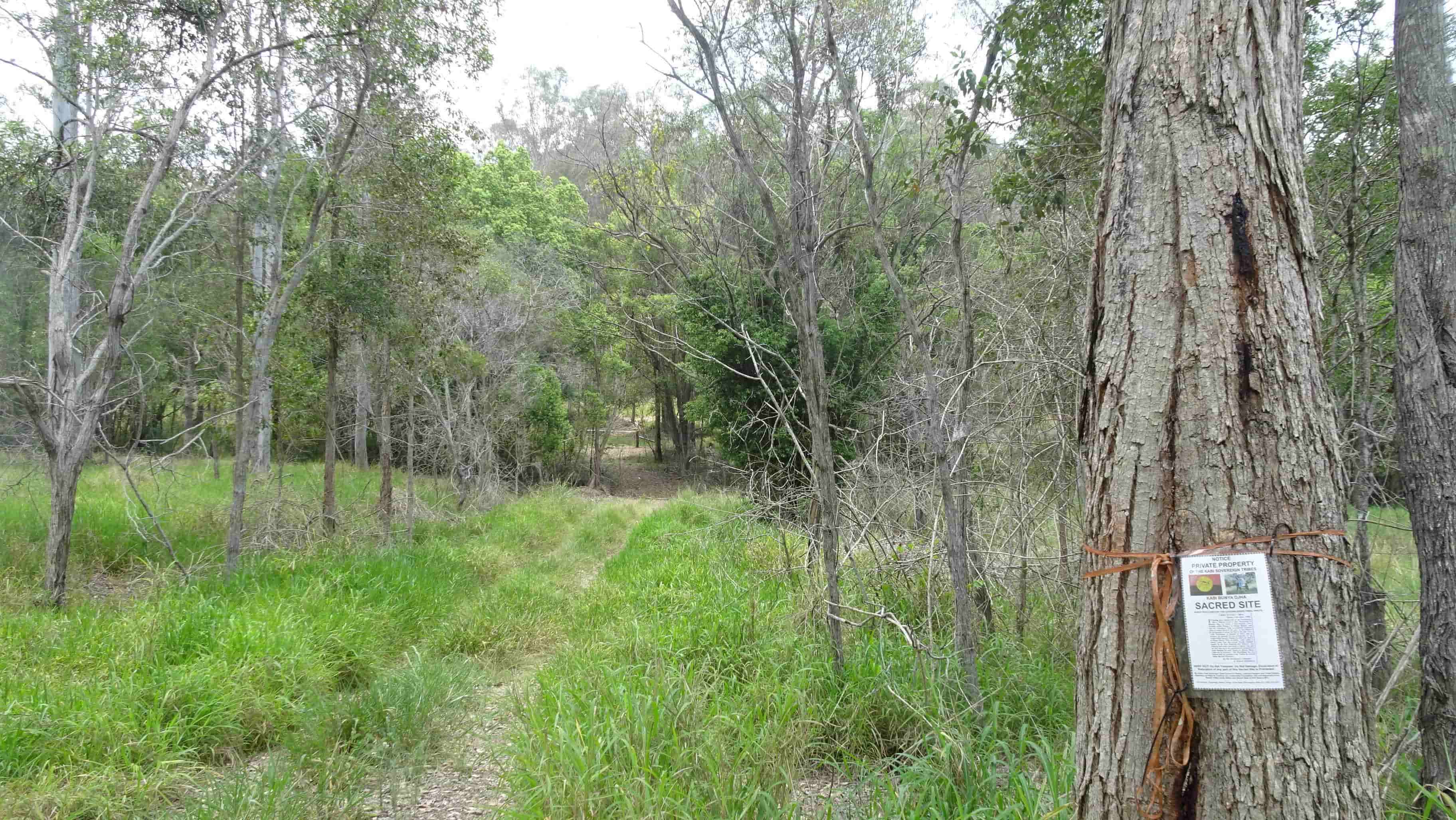 Dirt track leading to gated private property