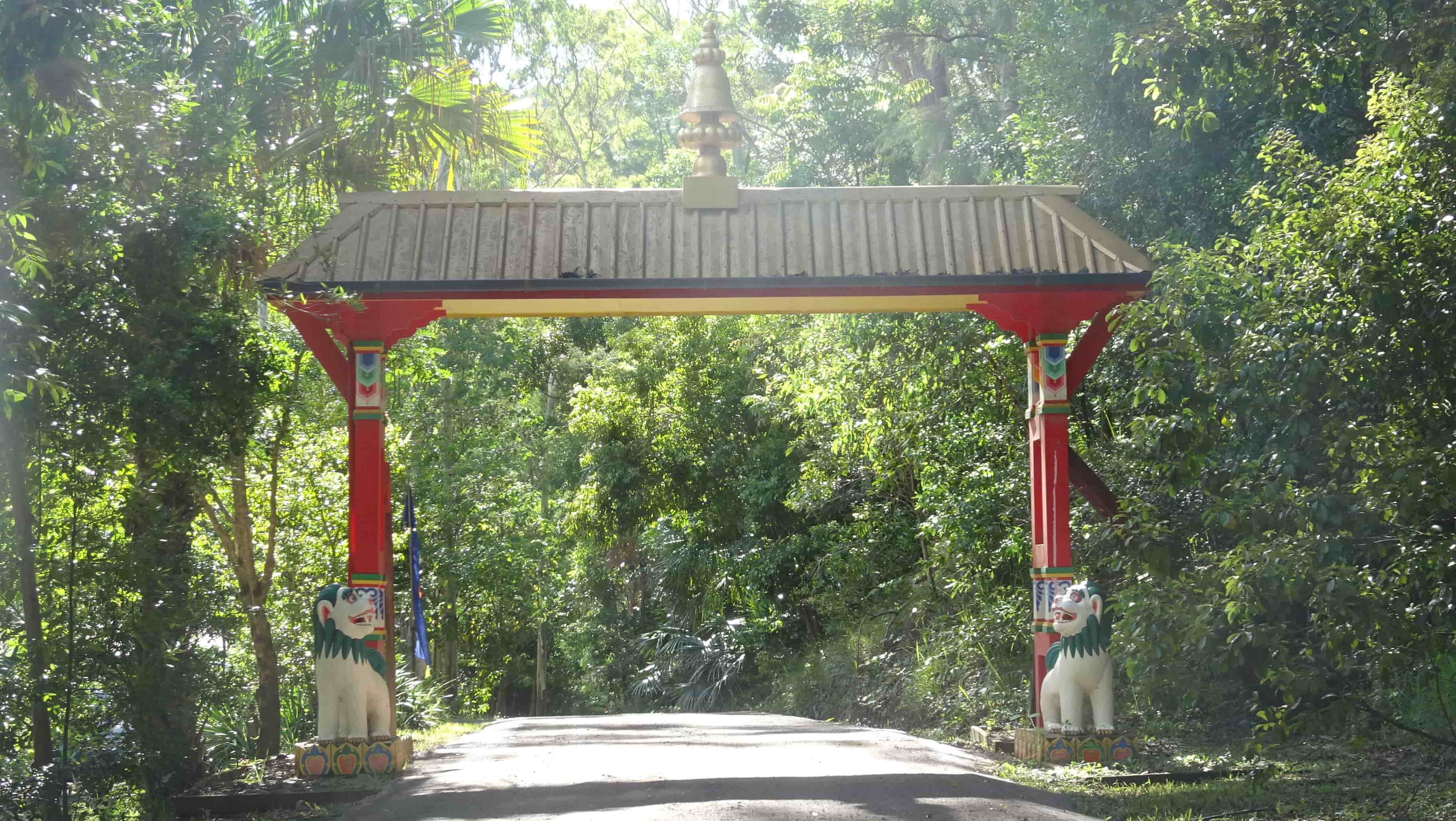 Ornate painted entrance gate in bush setting