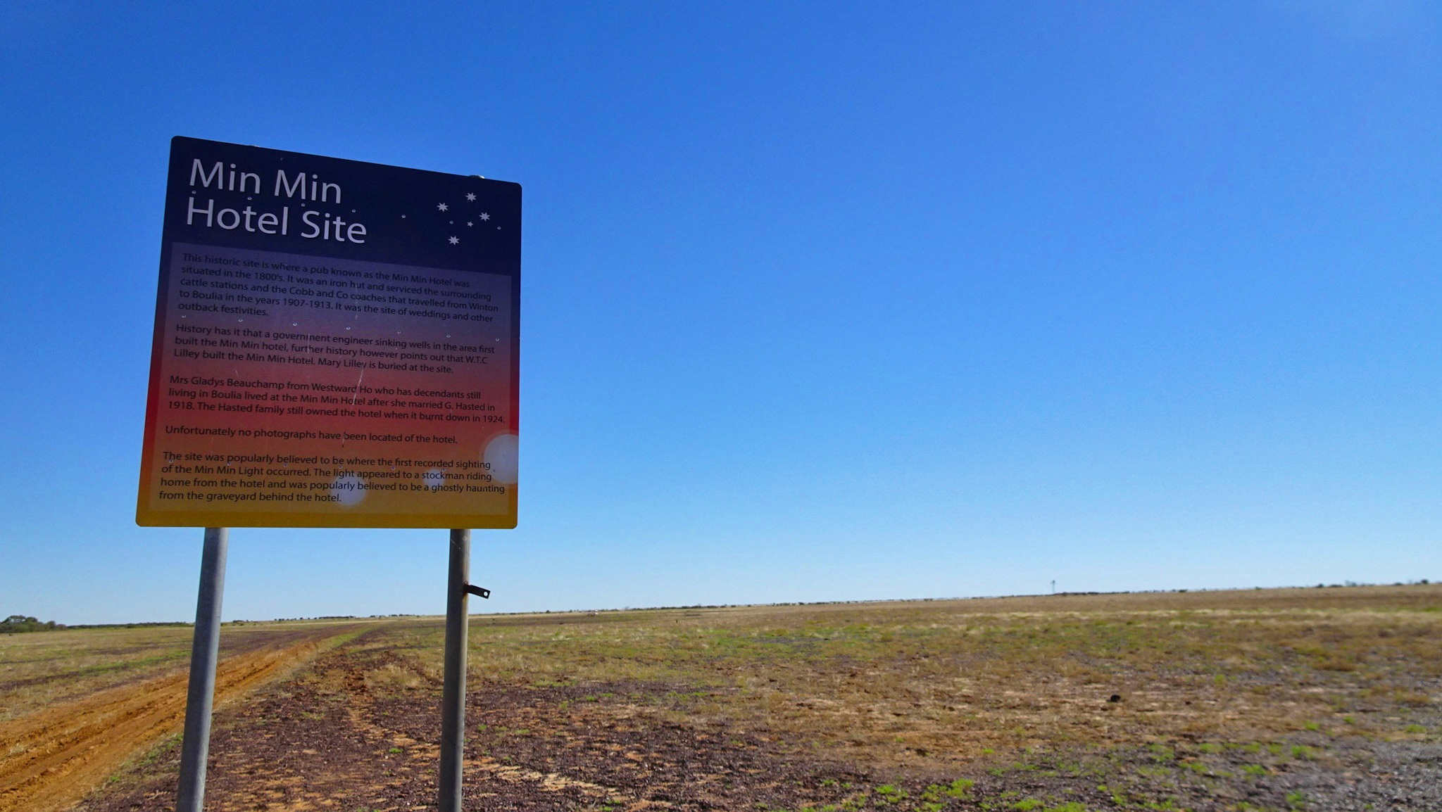 Min Min Hotel Site signage in front of desolate land