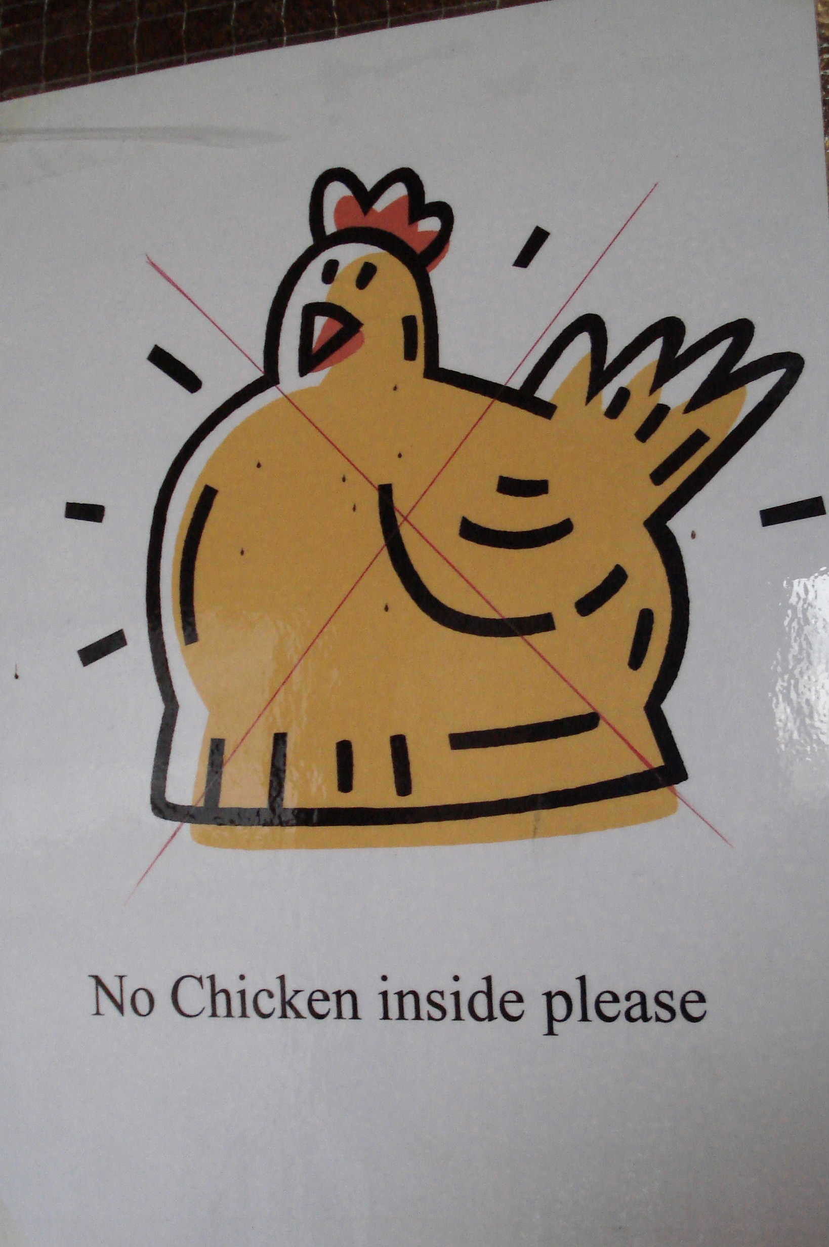 "No chicken inside please" sign of cartoon chicken with a cross through it